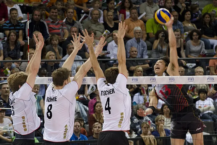 Volleyball attack against a triple block